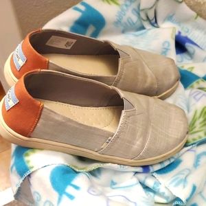 Boys light blue Toms shoes